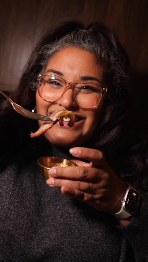 Stephanie trying crispy pork belly