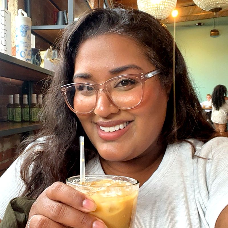 Stephanie with a drink at a restaurant
